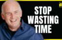 A smiling man in a blue shirt, positioned against a black background with bold white text on the right that reads "STOP WASTING TIME." In the upper right corner, a yellow box contains the logo "The Chase Jarvis LIVE Show." The image has a bright yellow border.